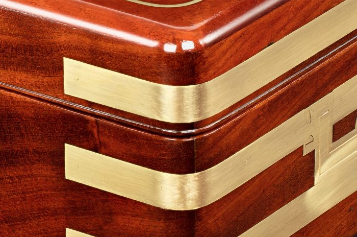 Brass strapped binding on an antique jewellery box in solid mahogany, by Asprey.