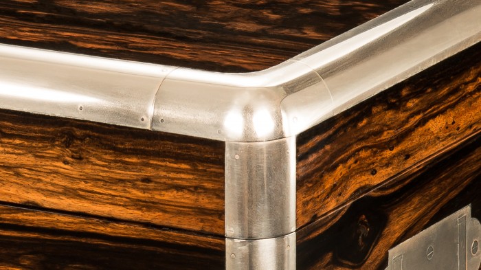 Nickel plated brass radial edging on an antique jewellery box in coromandel, retailed by Ernest Renton.