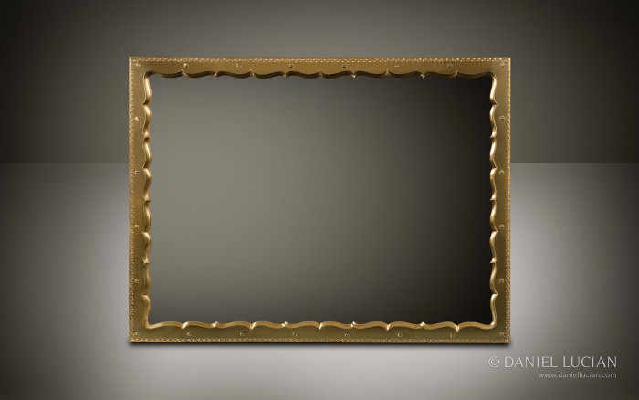 An ornately shaped and engraved brass framed mirror from an antique jewellery box with Betjemann Patent 'Automatic' mechanism by Howell, James & Co.