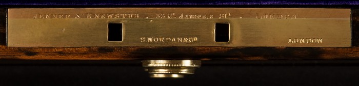 Engraved lock plate bearing the manufacturer's and retailer's mark of Jenner & Knewstub, as well as the locksmith's mark of S. Mordan & Co.