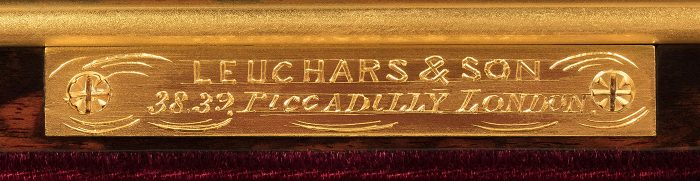 'Leuchars & Son. 38, 39. Piccadilly London.' engraved gilt-brass manufacturer's plate from a miniature antique jewellery box in coromandel.