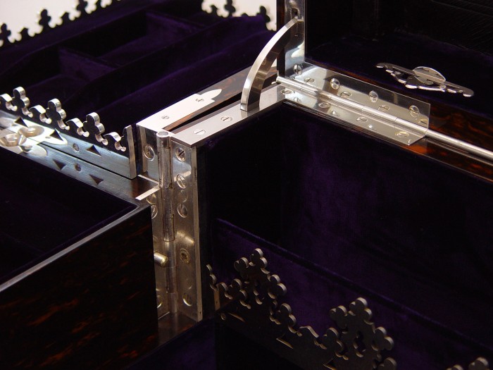 Silver plated hinge and gallery from an antique jewellery box with Betjemann Patent mechanism by Jenner & Knewstub.