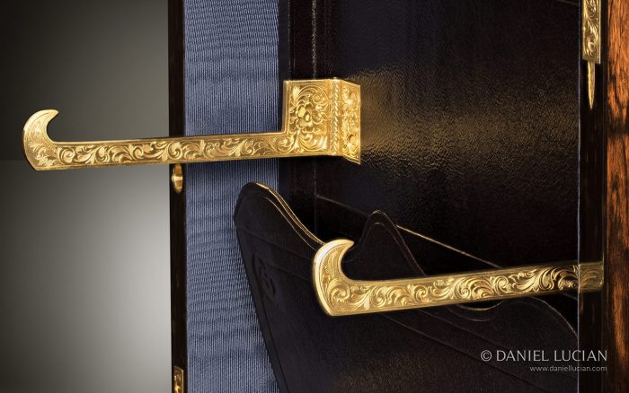 Two hinged engraved brass brackets open out to 90-degrees in order to hold the mirror panel at a useable height and angle.
