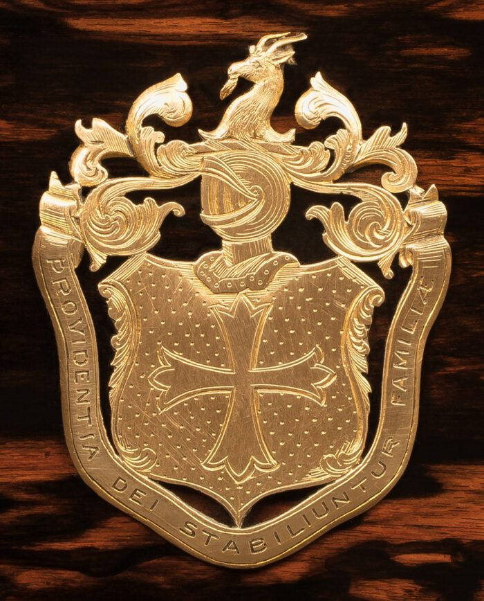 Engraved coat of arms crest from 1873, belonging to the Lamplugh family of Sutton, mounted on an antique jewellery box in coromandel with Betjemann Patent 'automatic' mechanism.