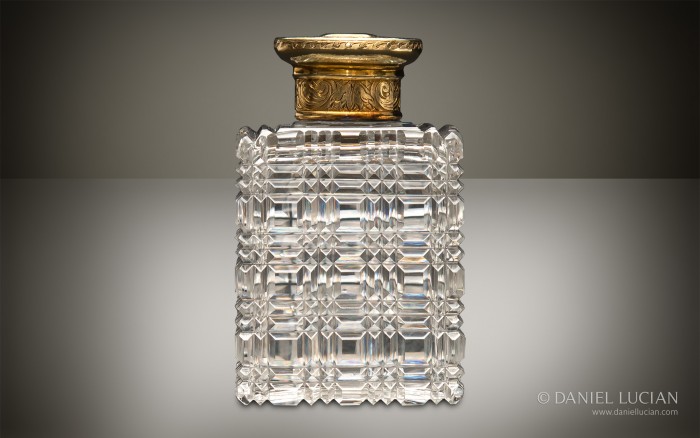 Perfume bottle from an antique dressing case with silver-gilt / gold fittings by Asprey & Sons.