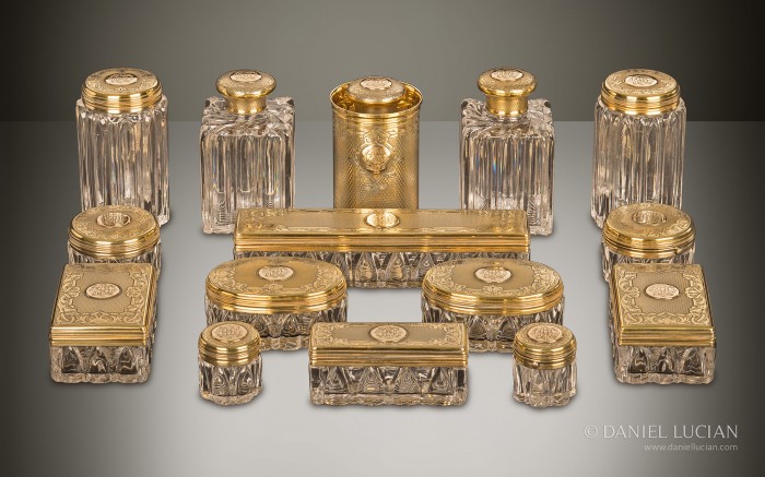 Antique dressing case bottles and jars with silver-gilt / gold fittings by Asprey & Sons.