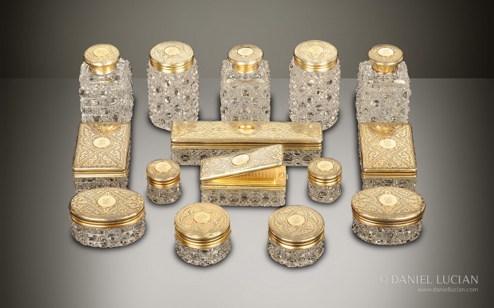 Antique dressing case bottles and jars with silver-gilt / gold fittings by Walter Thornhill.