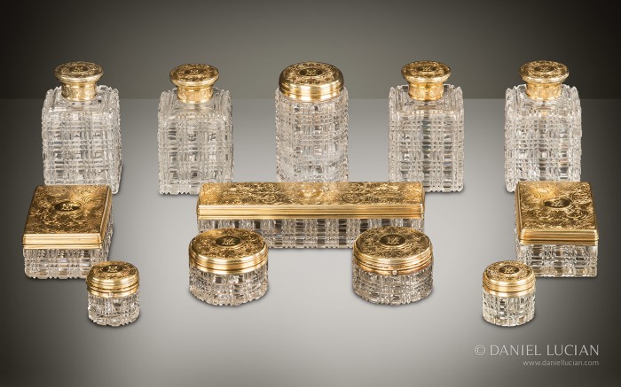 Antique dressing case bottles and jars with silver-gilt / gold fittings by Asprey.