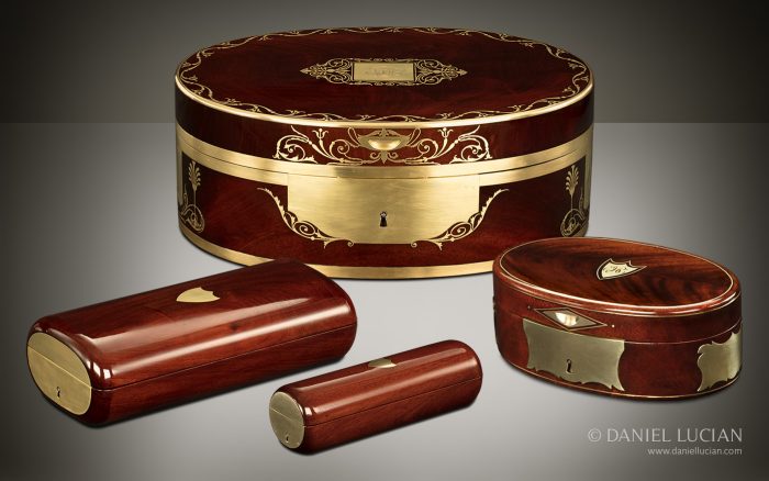 French antique nécessaire de voyage boxes, manufactured from Cuban mahogany, in elliptical and circular cylinder forms.