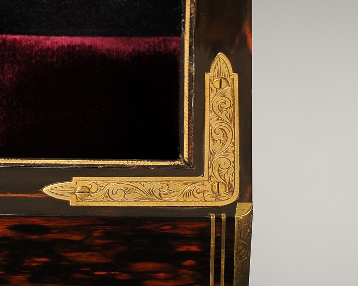 Engraved gilt-brass corner mount from a dome-top antique jewellery box in coromandel.