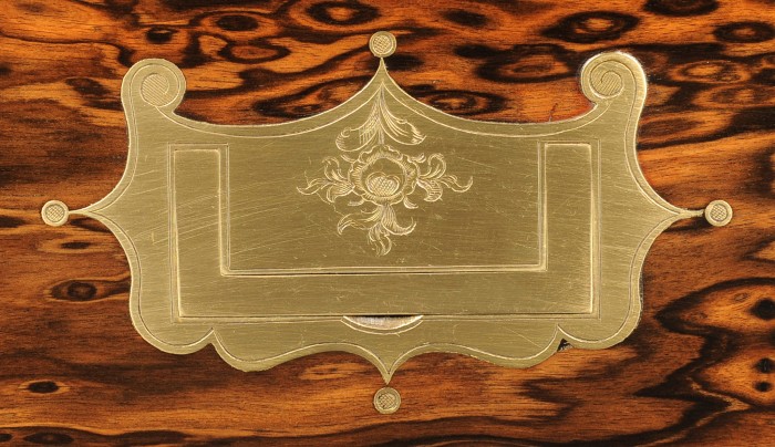 Ornate brass handle with engraved decoration from an antique coromandel box by Leuchars.