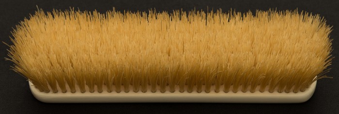 Antique ivory brush with boar hair bristles.