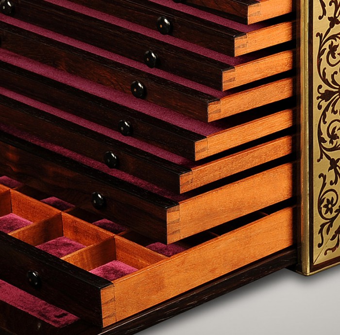 Dovetail-joined drawers from an antique jewellery cabinet in rosewood with foliate brass inlay and ten drawers.