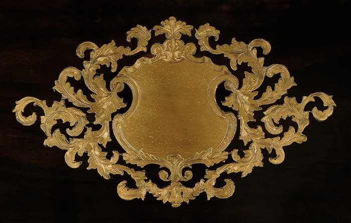 Engraved foliate brass escutcheon from a French antique jewellery box in ebony with brass inlay by Alphonse Giroux & Cie, Paris.