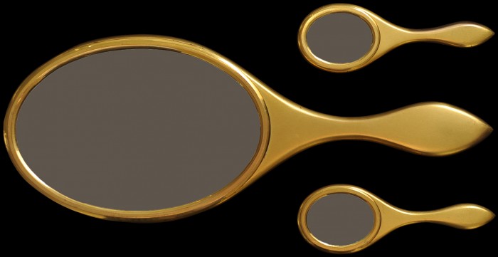 A set of three gilt-brass hand mirrors with standard, convex and concave mirror glass taken from an antique dressing case by Betjemann & Sons.