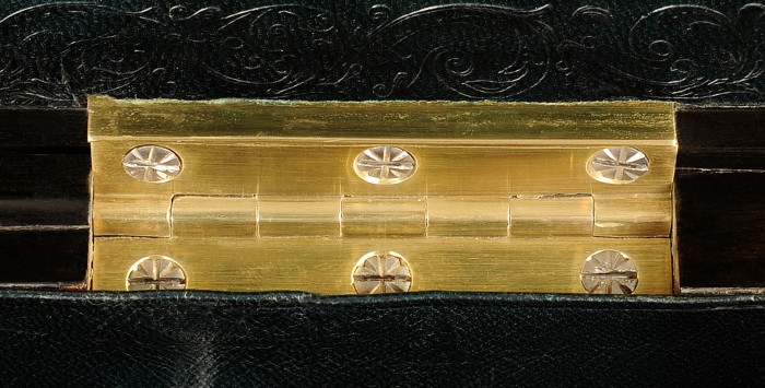 Antique brass hinges with decorative incisions to the screw heads by Howell, James & Co.