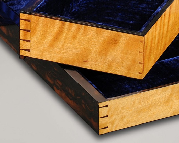 Dovetail joints on solid satinwood drawers.