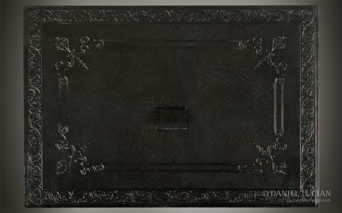 Antique blind tooled leather drawer lid from a jewellery box in amboyna, manufactured by Howell, James & Co.