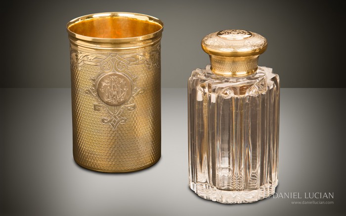 Spirit bottle and beaker from an antique dressing case with silver-gilt / gold fittings by Asprey & Sons.