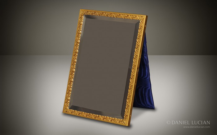 Pierced gilt-brass mirror frame with beveled glass from an antique dressing case by Jenner & Knewstub.