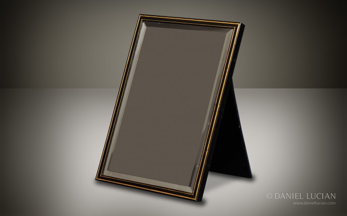 Leather-bound mirror frame with gold tooling and beveled glass taken from an antique Asprey jewellery box.