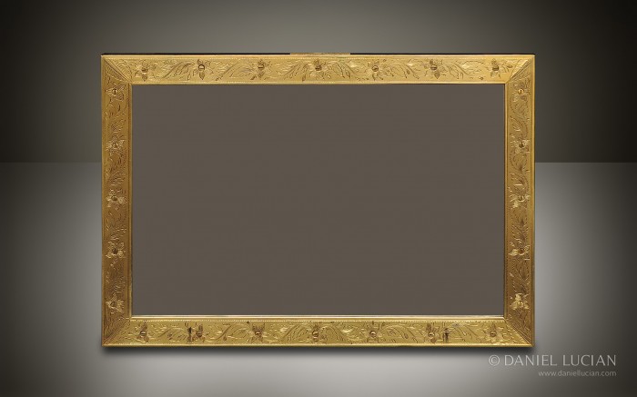 Engraved gilt-brass facing applied to a coromandel mirror frame taken from a dome-top antique jewellery box.