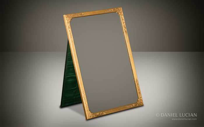 Gilt-brass mirror frame with engraved and engine turned decoration taken from an Asprey antique dressing case.