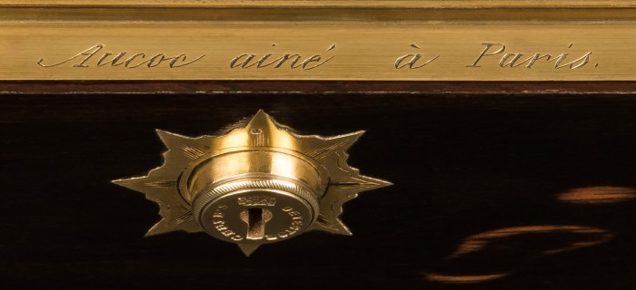Engraved lock plate bearing the manufacturer's and retailer's mark of, 'Aucoc Ainé à Paris'.