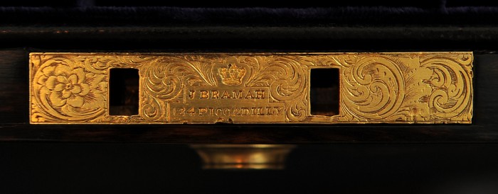 Bramah lock with decorative engraving, stamped with 'J. Bramah - 124 Piccadilly, London'.