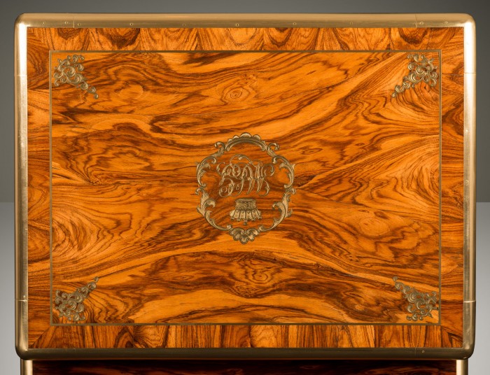 Kingwood veneer from an antique jewellery box with brass inlaid coronet monogram.