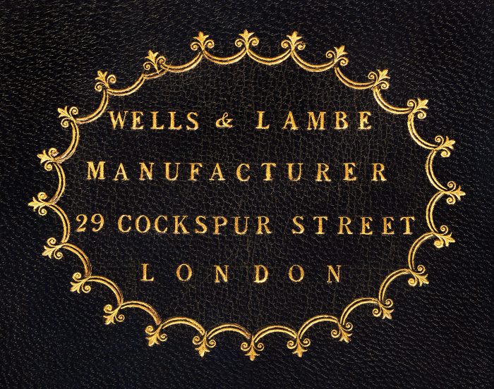 An 1813 Wells & Lambe manufacturer’s mark gold tooled onto leather from an antique jewellery box in kingwood.