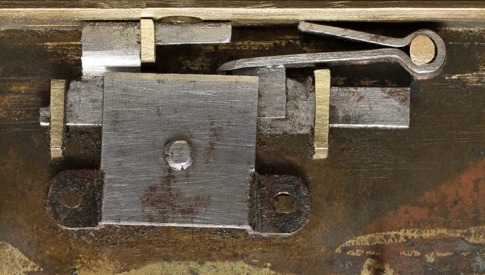 An 1820's French lock in its 'double locked' position. Note the elongated bolt arm (top centre) to allow for the mechanism's double throw action.
