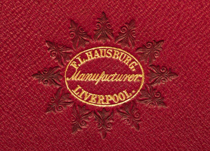 F. L Hausburg manufacturer’s mark gold tooled onto leather from an 1852 antique dressing case in burr walnut.